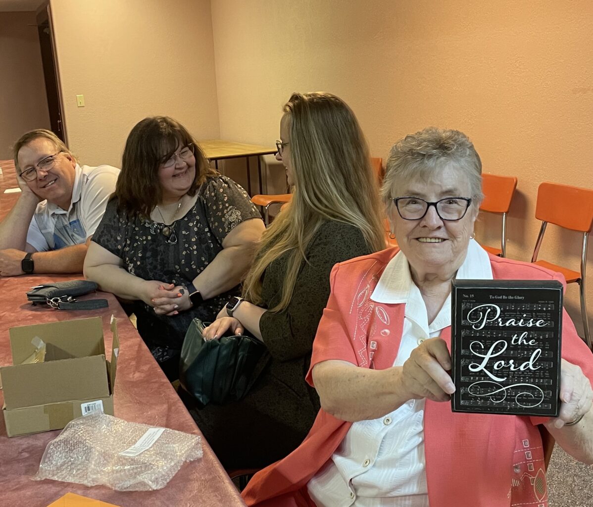 Weneen holding her plaque